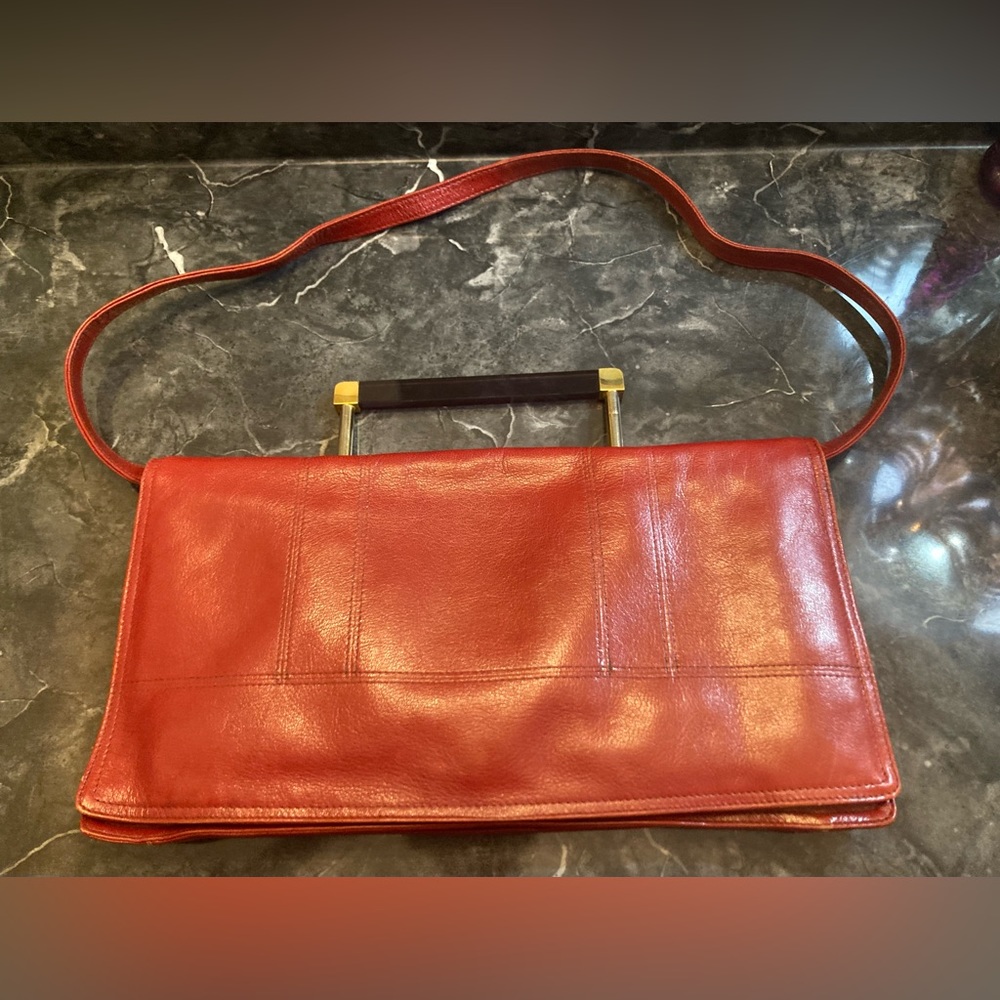 Vintage Charles Jourdan deep red rust leather purse. A place for a cell phone.